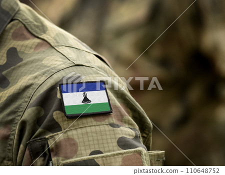 Flag of Lesotho on military uniform. Army, troops, soldiers. Collage. Flag of Lesotho on military uniform. Army, troops, soldiers. Collage. 110648752