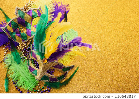 Mardi gras background with mask and feather Mardi gras background with mask and feather 110648817