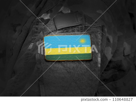 Flag of Rwanda on soldiers arm. Rwanda flag on military uniform. Army, troops, Africa (collage). Flag of Rwanda on soldiers arm. Rwanda flag on military uniform. Army, troops, Africa (collage). 110648827