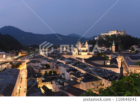 Salzburg cityscape at night with fortress Hohensalzburg, Austria 110649241