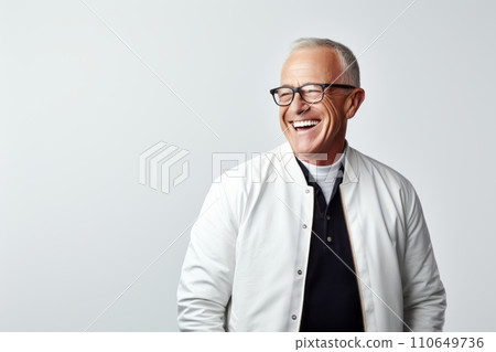Portrait of happy senior man in eyeglasses smiling against grey background. Portrait of happy senior man in eyeglasses smiling against grey background. 110649736