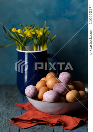 Eggs and daffodils 110650174