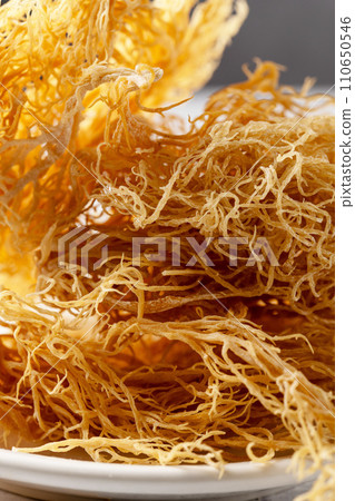Sea Moss, yellow dried seaweed, healthy used as food supplement. 110650546