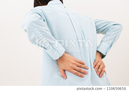 Middle women suffering from low back pain 110650658