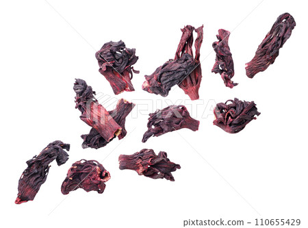 Hibiscus tea leaves flying close-up on a white background. 110655429