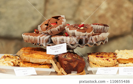 Brownies and other fruit pastry at bakery stand at farmers market 110655486