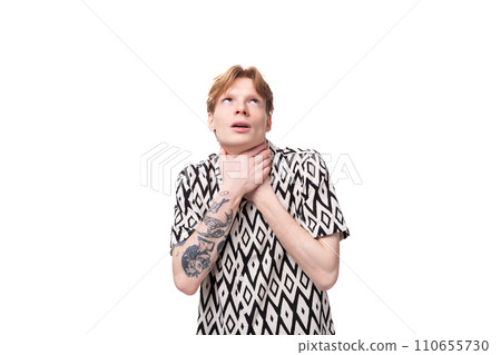 a young man with red hair dressed in a short-sleeved shirt feels tired from an excess of feelings a young man with red hair dressed in a short-sleeved shirt feels tired from an excess of feelings 110655730