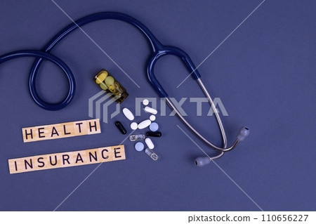 Health insurance concept with stethoscope and pills Health insurance concept with stethoscope and pills 110656227