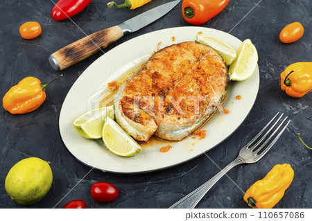 Grilled salmon steak in orange marinade. 110657086