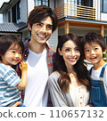 A picture of a smiling family of four people, a young couple and two children. 110657132