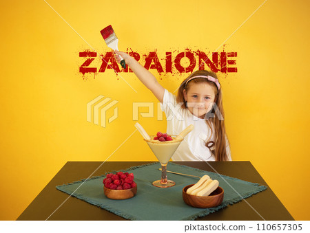 Cute baby girl with dessert and zabaione inscription. 110657305