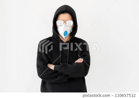 Woman in black jacket with glasses and face mask 110657512