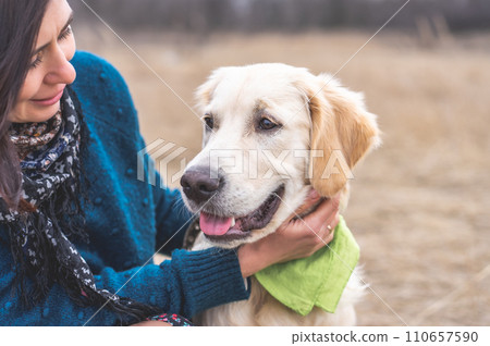 Adorable dog with lovely owner outside 110657590