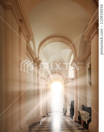 Girl sit on the bench in the church 110658056