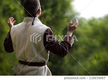 Praying man with raised hands Praying man with raised hands 110658067