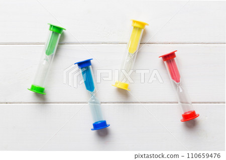 hourglass on the table, sand clock as time passing concept for business deadline, copy space hourglass on the table, sand clock as time passing concept for business deadline, copy space 110659476