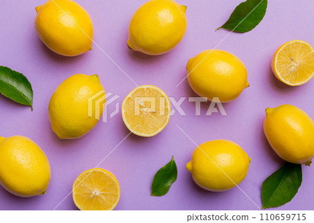 Many fresh ripe lemons as colored background, top view. Elegant background of lemon and lemon slices Top view flat lay 110659715