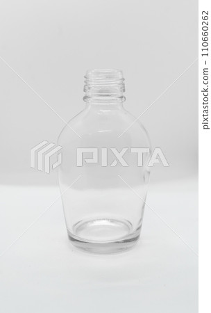 Empty bottle glass lying on white background with copy space for text. Empty bottle glass lying on white background with copy space for text. 110660262