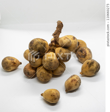 Wollongong fruit on white background with copy space for text. Langsat fruit Wollongong fruit on white background with copy space for text. Langsat fruit 110660273