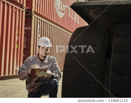 Engineers walking and checking condition Forklift container . 110661235
