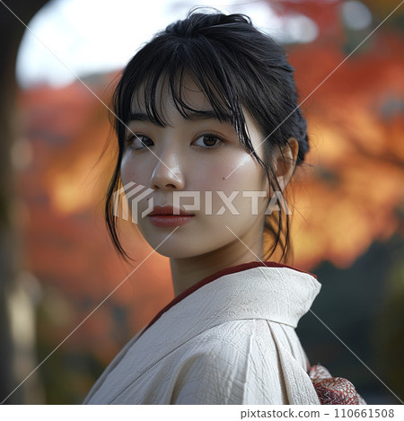 A woman in a kimono with autumn leaves in the background <AI image> 110661508