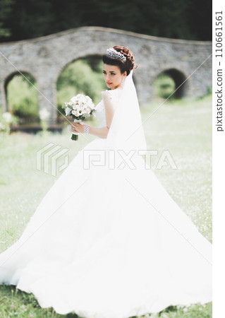 Beautiful fashion bride in wedding dress posing Beautiful fashion bride in wedding dress posing 110661561