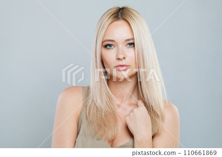 Glorious blonde woman with long straight hair and clean fresh pure perfect skin isolated  110661869