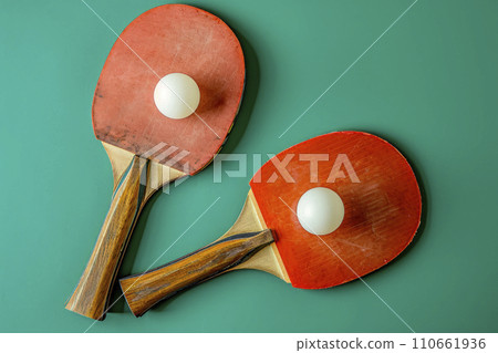 ping pong rackets and ball on green background 110661936