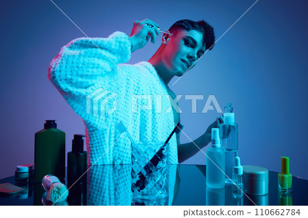 Glowing Duality. Step into radiant world of dual beauty as masculine and feminine converge in neon-lit bathroom. Glowing Duality. Step into radiant world of dual beauty as masculine and feminine converge in neon-lit bathroom. 110662784