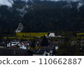 Village Enshrouded in Mist: A Serene Retreat Amidst the Mountains and Forests. 110662887