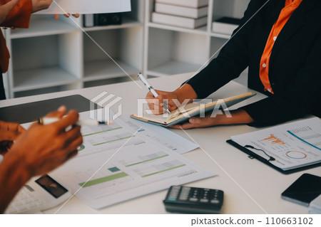 Co working conference, Business team meeting present, investor colleagues discussing new plan financial graph data on office table with laptop and digital tablet, Finance, accounting, investment. 110663102