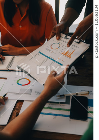 Male mature caucasian ceo businessman leader with diverse coworkers team, executive managers group at meeting. Multicultural professional businesspeople working together on research plan in boardroom. 110663134