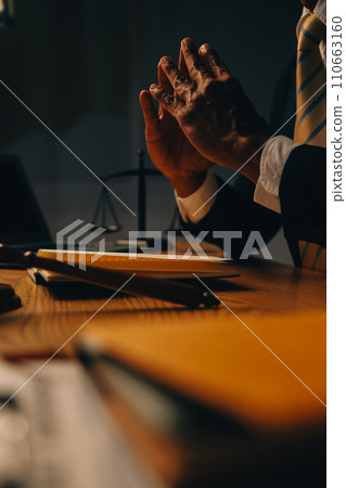 Judge gavel with Justice lawyers having team meeting at law firm background. Concepts of Law and Legal services. 110663160