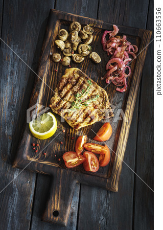 Beefsteak with mushrooms and tomatoes Beefsteak with mushrooms and tomatoes 110663556