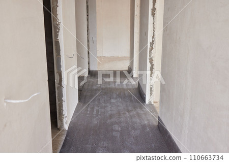 Sheet of expanded polystyrene on the concrete floor for house thermal insulation during constructions 110663734