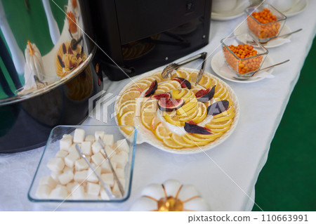 light snacks for the holiday, catering. Various light snacks. Catering plate. Assortment of sandwiches on the buffet table. meat, fish, vegetable canapes. 110663991