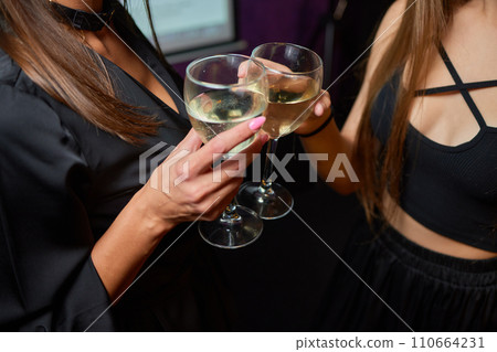 Clinking glasses with alcohol and toasting, party. Clinking glasses with alcohol and toasting, party. 110664231