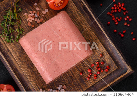 Delicious canned pink ham with salt, spices and herbs Delicious canned pink ham with salt, spices and herbs 110664404