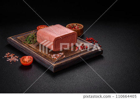 Delicious canned pink ham with salt, spices and herbs Delicious canned pink ham with salt, spices and herbs 110664405