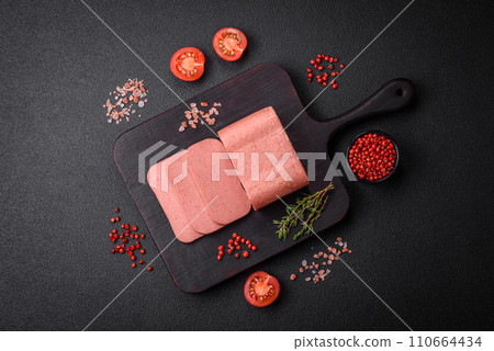 Delicious canned pink ham with salt, spices and herbs Delicious canned pink ham with salt, spices and herbs 110664434