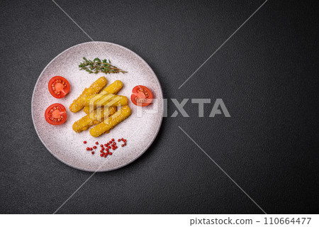Delicious crispy cheese sticks with mozzarella, salt and spices, breaded and fried in oil Delicious crispy cheese sticks with mozzarella, salt and spices, breaded and fried in oil 110664477