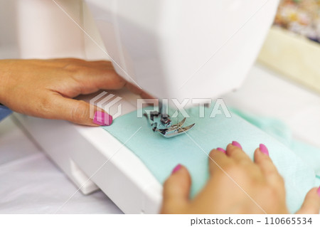 Close-up of Sewing Machine and Fabric Work 110665534