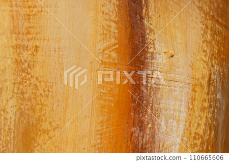 The bright texture of the canvas, painted in orange-yellow-brown colors with shades. 110665606
