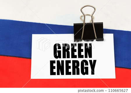 On the flag of Russia there is a business card with the inscription - Green energy On the flag of Russia there is a business card with the inscription - Green energy 110665627