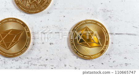 Top down view, golden commemorative EOS - EOSIO  cryptocurrency - coins on white stone board 110665747