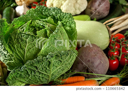 Heap of mixed vegetables - savoy cabbage, beet root, zucchini, tomatoes, cauliflower carrot and other veggies Heap of mixed vegetables - savoy cabbage, beet root, zucchini, tomatoes, cauliflower carrot and other veggies 110665842