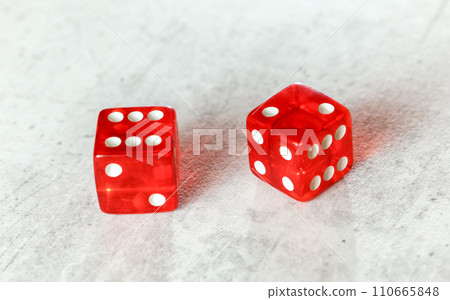 Two translucent red craps dices on white board showing Easy Eight (number 6 and 2) 110665848
