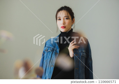 woman in denim jacket 110666571