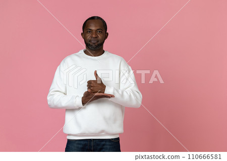 Deaf mute black man wearing white sweatshirt gesturing sign language 110666581