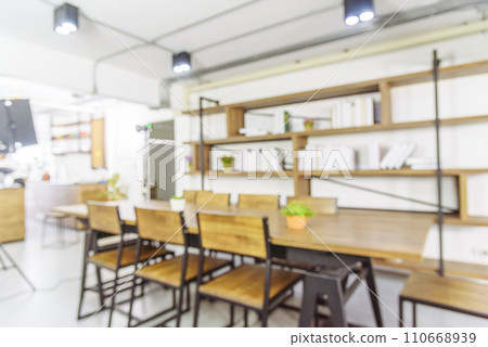 Blurred background cafe coffee shop restaurant in shopping mall with light bokeh business event retail store. Blurry background interior design bar table chair windows decorate indoor space display 110668939